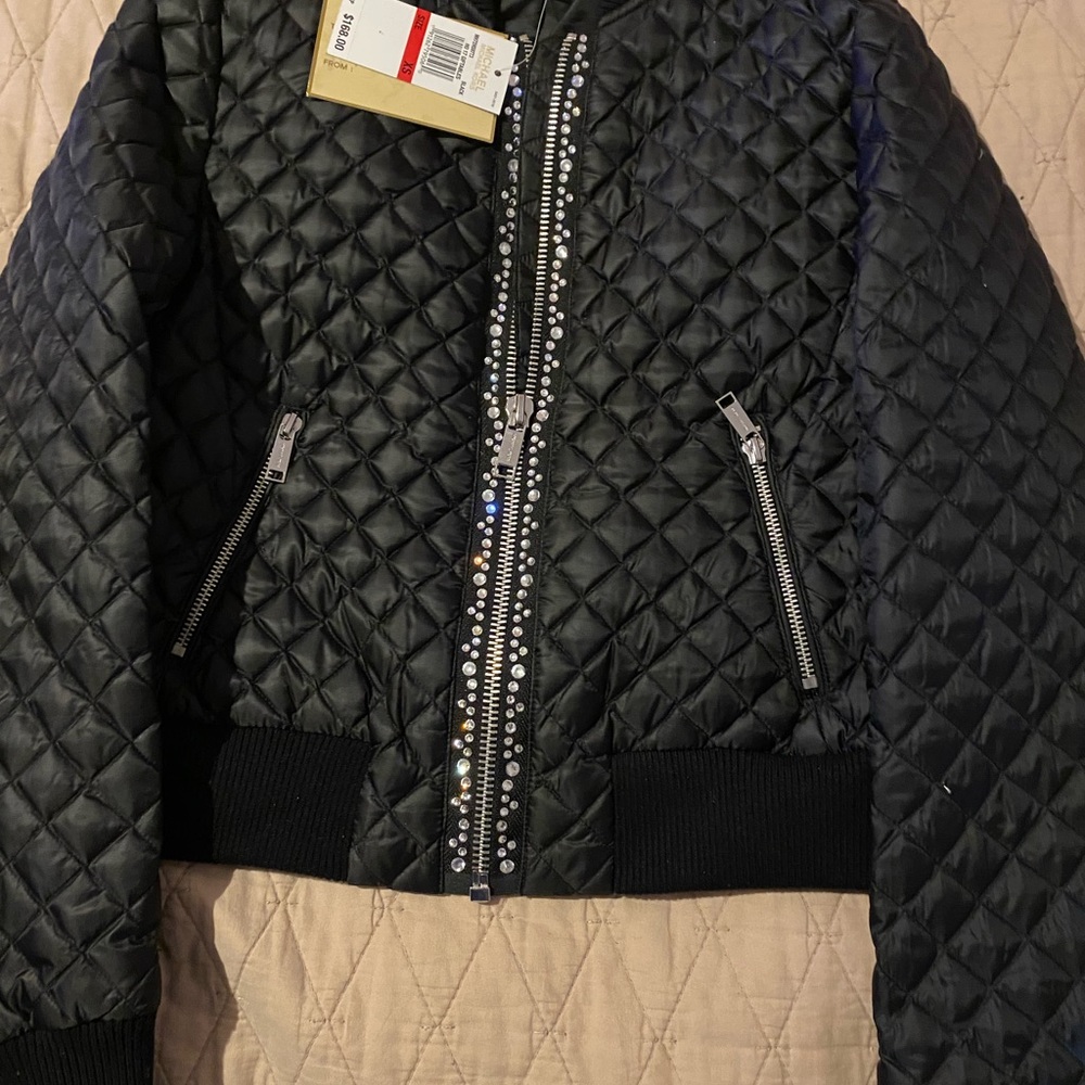 Black and silver Michael kors jacket.